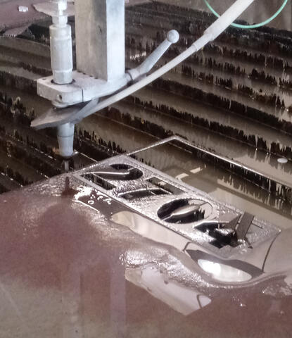 Water jet cutting out an address sign